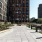 a walkway between buildings with High Line in the background