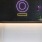 a white rectangular object with a purple logo on it